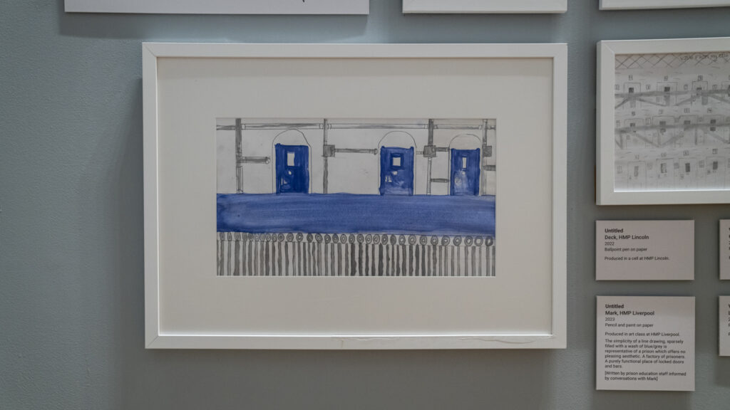 The simplicity of a line drawing, sparsely filled with a wash of blue/grey is representative of a prison which offers no pleasing aesthetic. A factory of prisoners. A purely functional place of locked doors and bars.