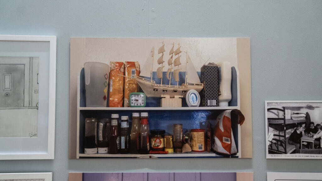 Personal items arranged on shelves in a cell at HMP Liverpool, 2023.