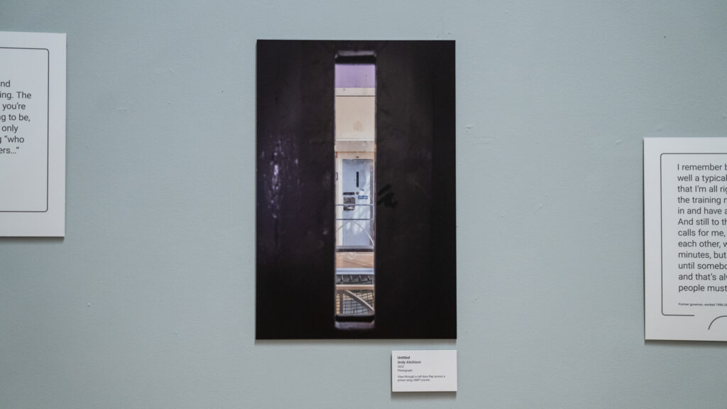 View through a cell door flap across a prison wing, HMP/YOI Lincoln, 2022.