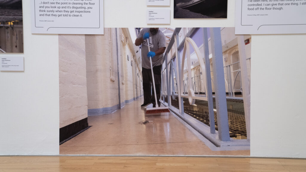 A wing floor is swept by a prisoner, HMP/YOI Lincoln, 2022