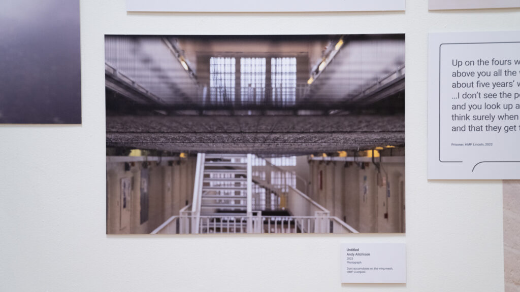 Dust acculumates on the suicide mesh, HMP Liverpool 2023
