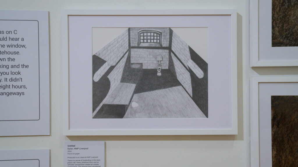 There is a sense of foreboding in this bare prison cell. Heavy shadows loom and an ‘off kilter’ perspective creates an uneasy composition. The drawing has a sculptural dimension as the cropped edges help to convey the feeling of the constricted space of a prison cell. [Statement written by prison education staff informed by conversations with Dylan]